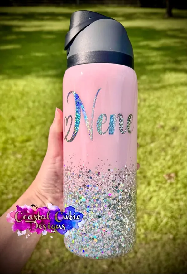 Pink bottle with a silver glitter fade and a holographic script name